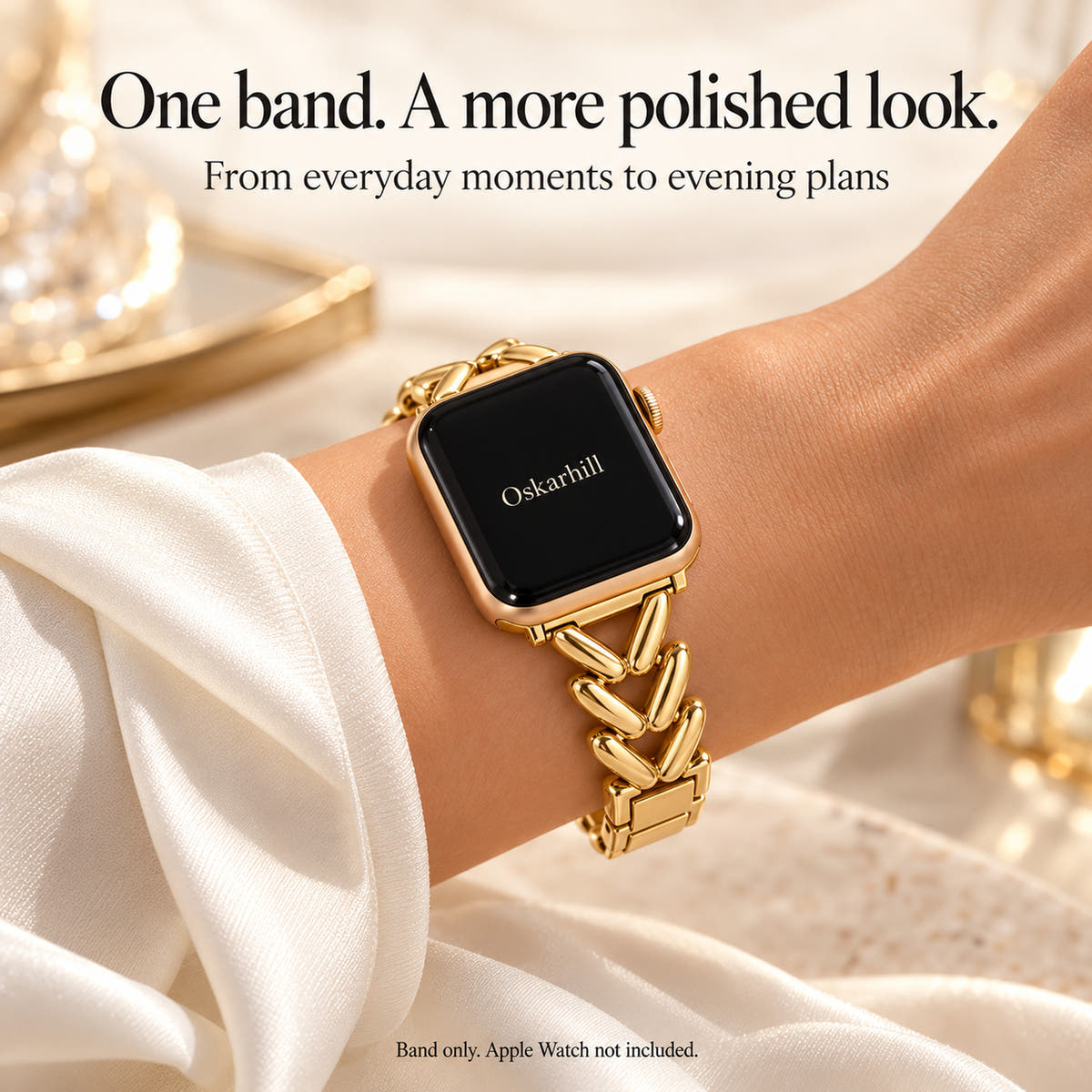 Monelle gold chevron watch band styled on a wrist with an ivory silk sleeve