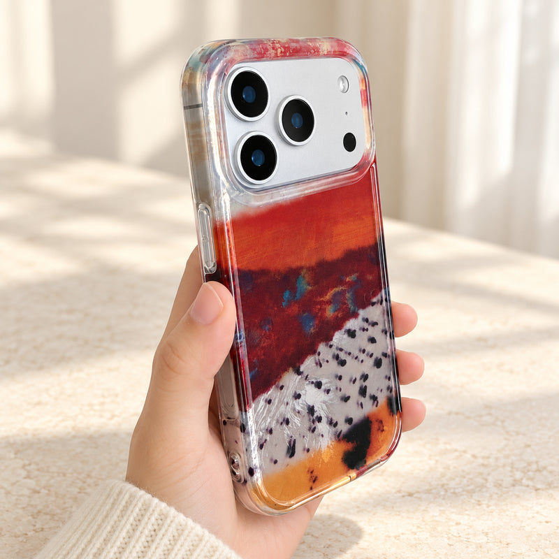 Abstract Earth Tone iPhone case held in hand with a glossy layered pattern and clear frame