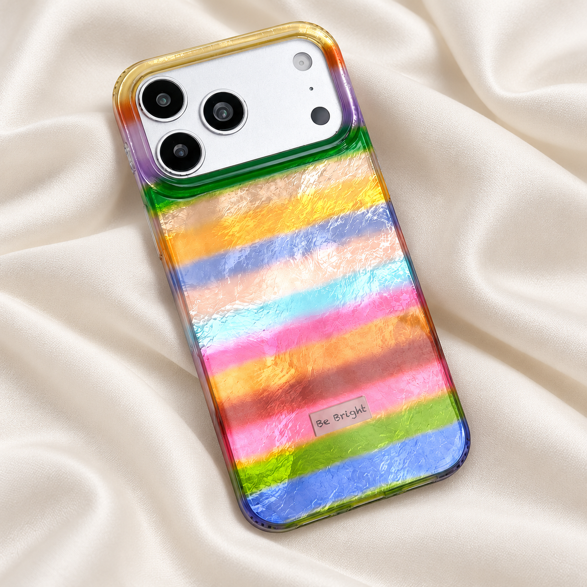 Be Bright rainbow stripe iPhone case — rainbow case on ivory fabric.