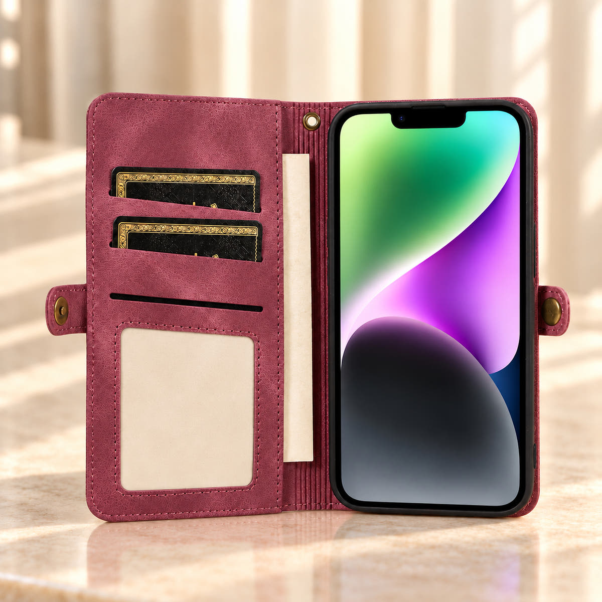 Open Plum BlushCarry wallet phone case showing inner card storage, a rectangular photo window, notes pocket and bronze-tone snap tabs.