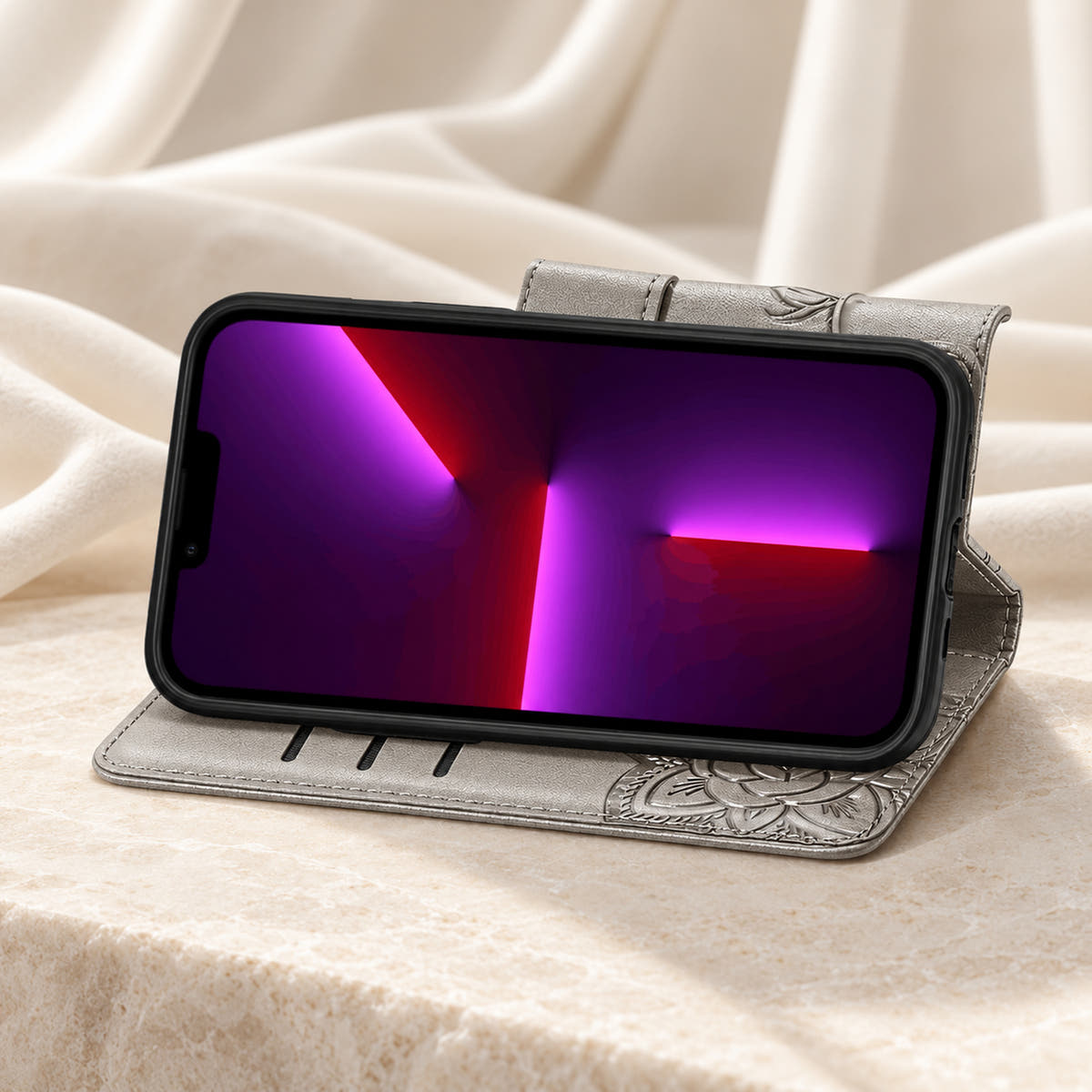 Butterfly iPhone wallet case in Gray folded into its landscape stand, with the original interior card-slot edges visible.