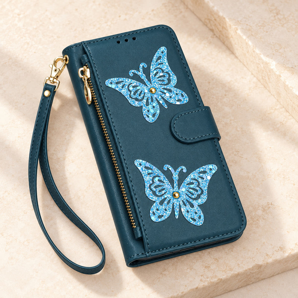 Forest Green Butterfly iPhone wallet case — closed cover and zip pocket on a tabletop