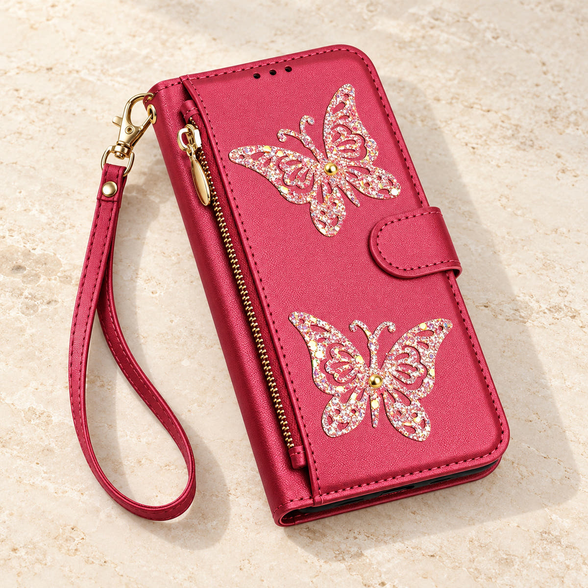 Red Butterfly iPhone wallet case — closed cover and zip pocket on a tabletop