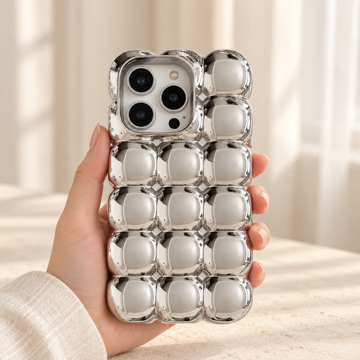 Silver Chrome Bubble Bear iPhone case — handheld window view
