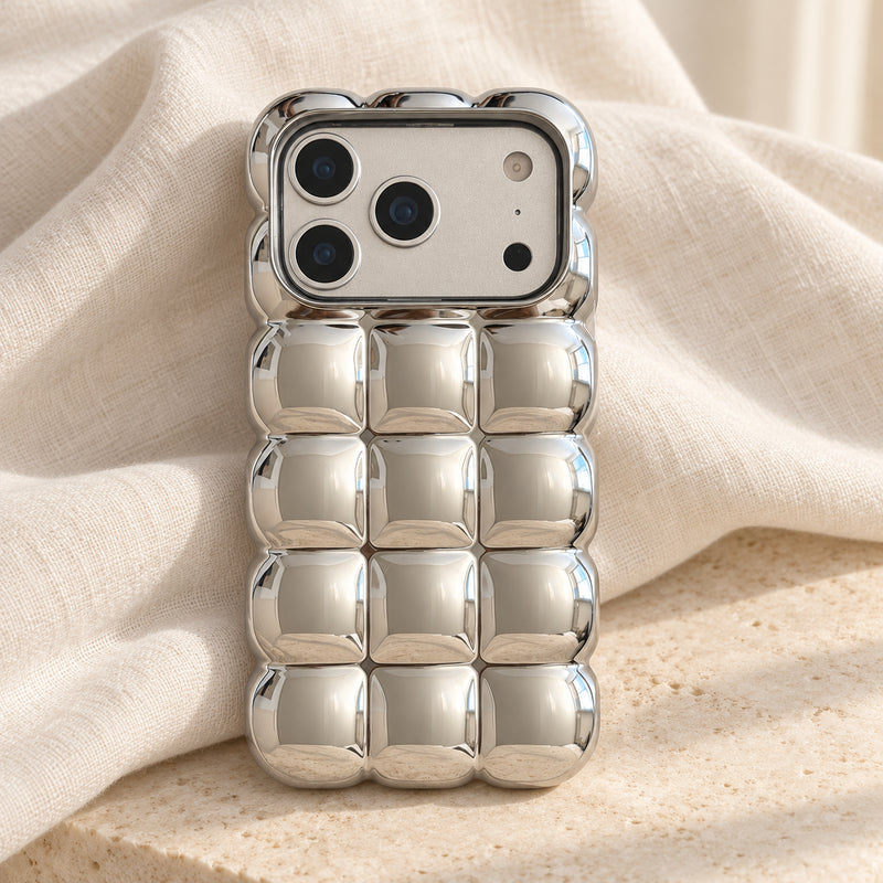 Silver Chrome Bubble Bear iPhone case — linen flatlay view