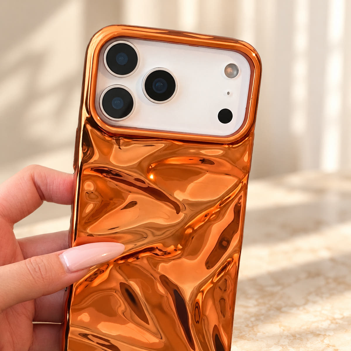 Copper-orange Chrome Wave iPhone case — camera close view