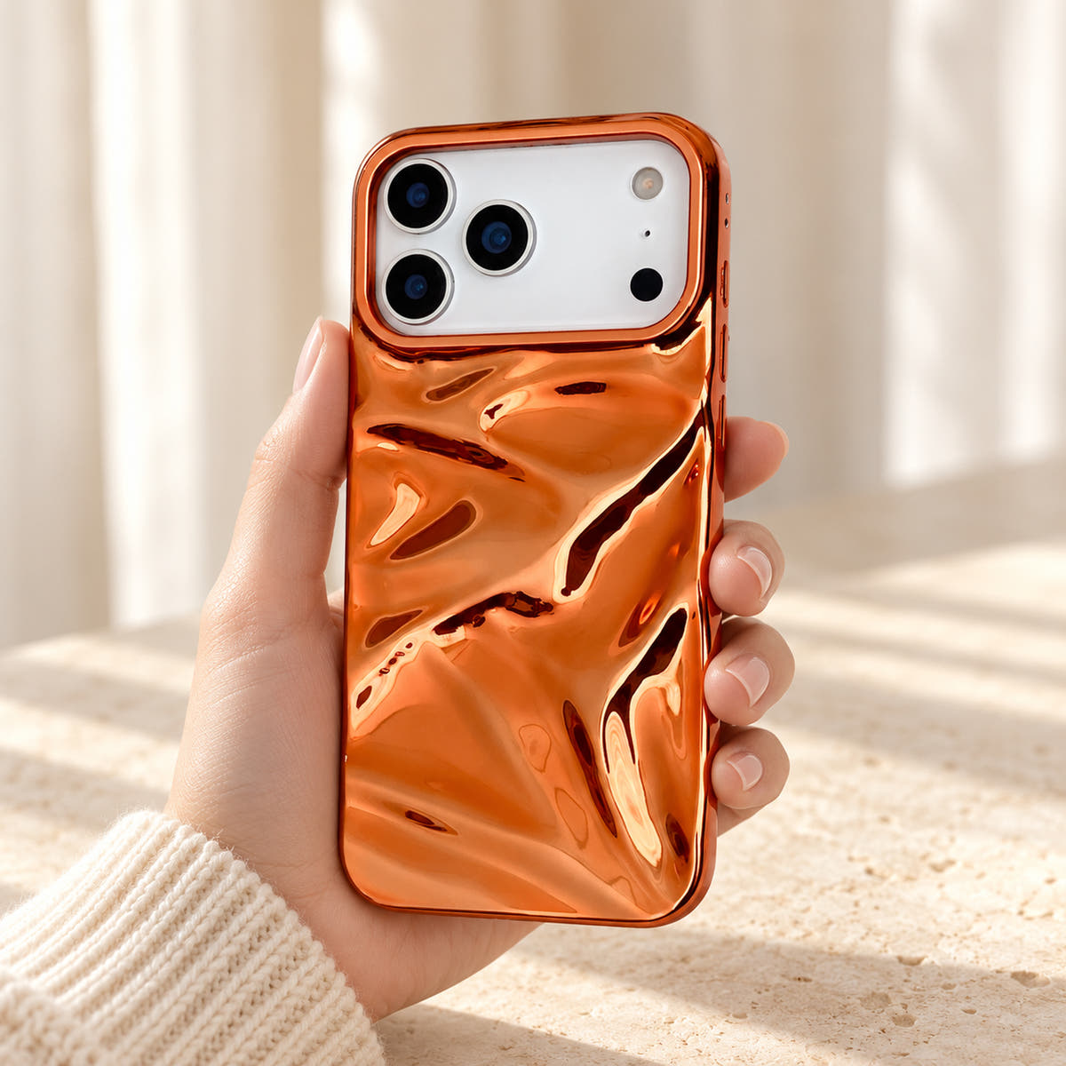 Copper-orange Chrome Wave iPhone case — handheld relaxed view