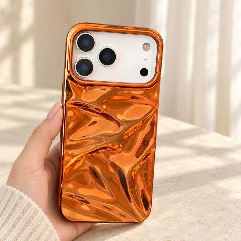 Copper-orange Chrome Wave iPhone case held upright showing its full back design