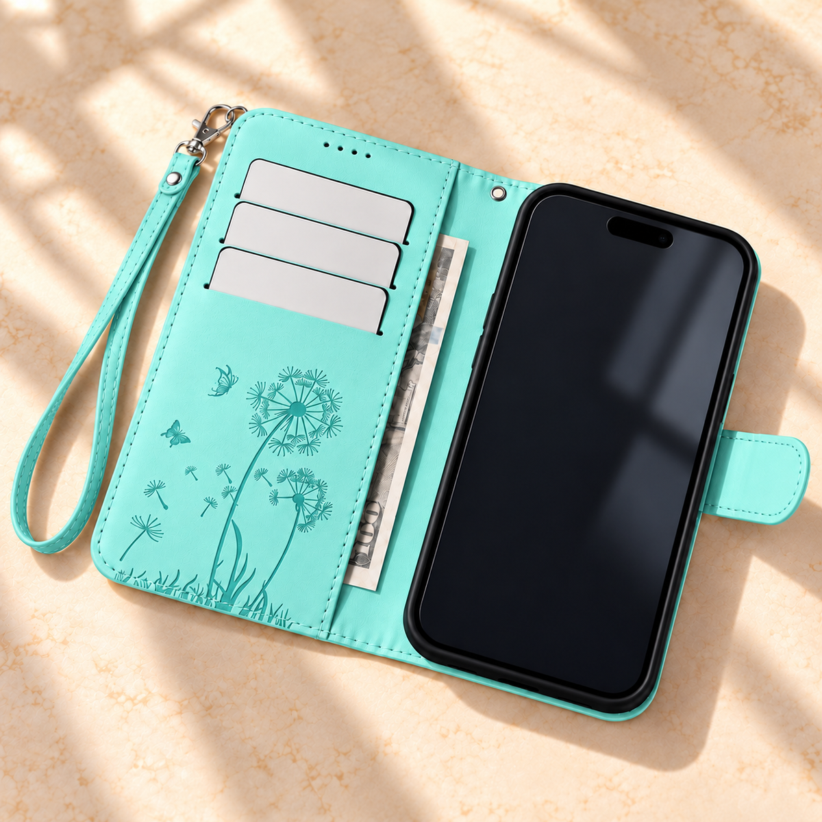 Mint Dandelion and Butterfly wallet phone case open, showing three card slots and an inner cash pocket.