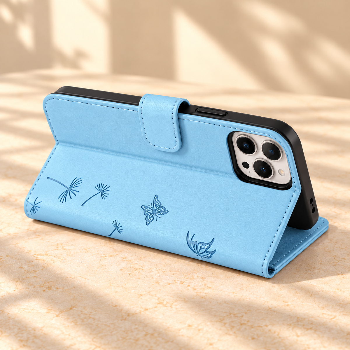 Sky Blue Dandelion and Butterfly wallet phone case folded into a landscape viewing stand.