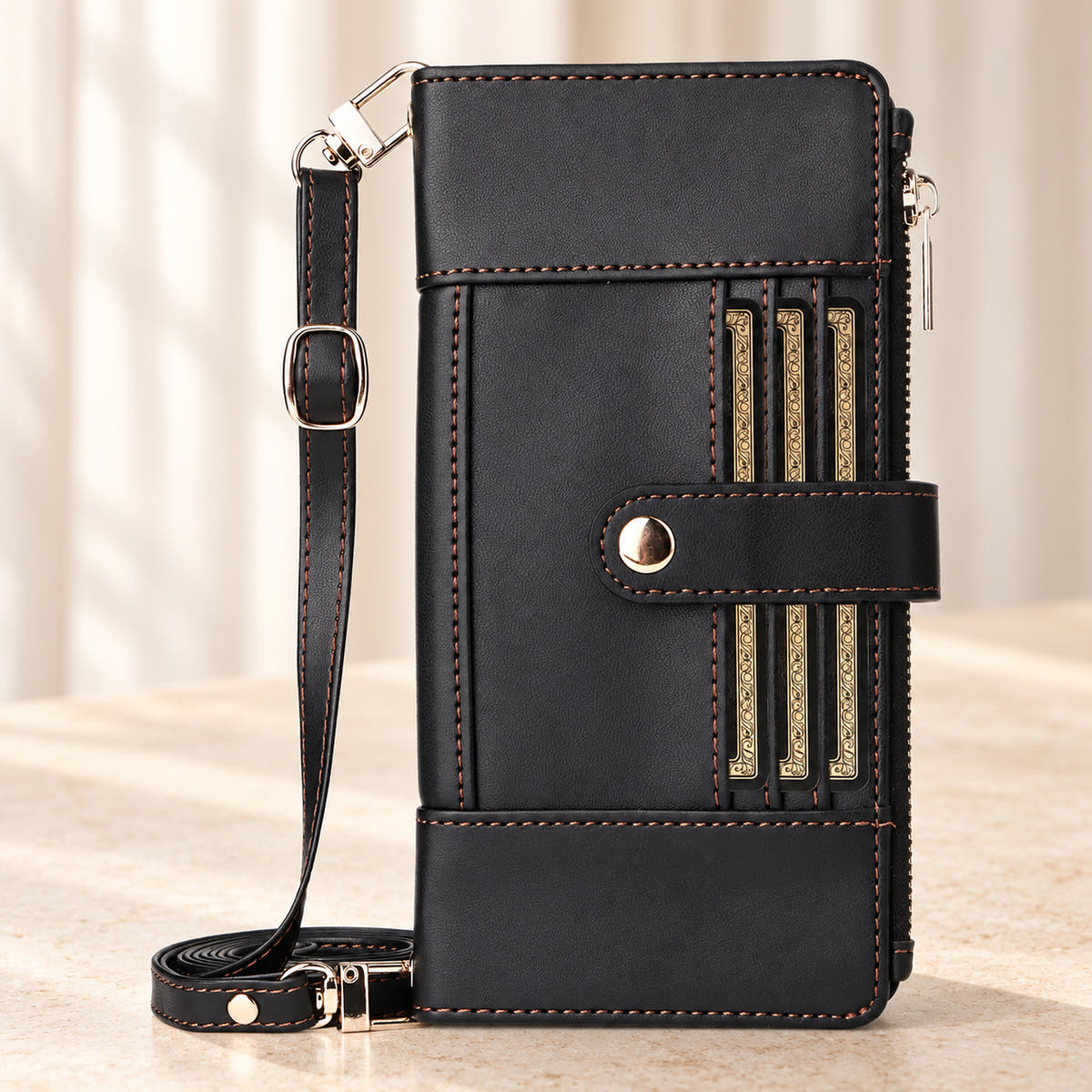 Elaris Crossbody iPhone wallet case in Black, closed front view with adjustable strap.