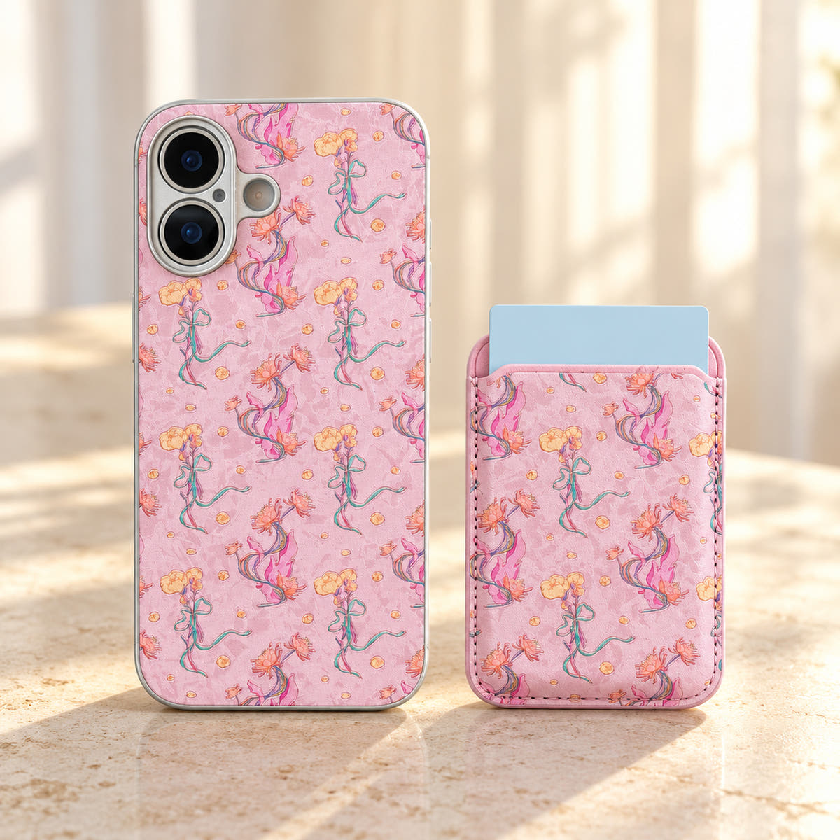 Pink Elysia Floral case beside its detached matching card wallet, showing the floral design on both pieces.