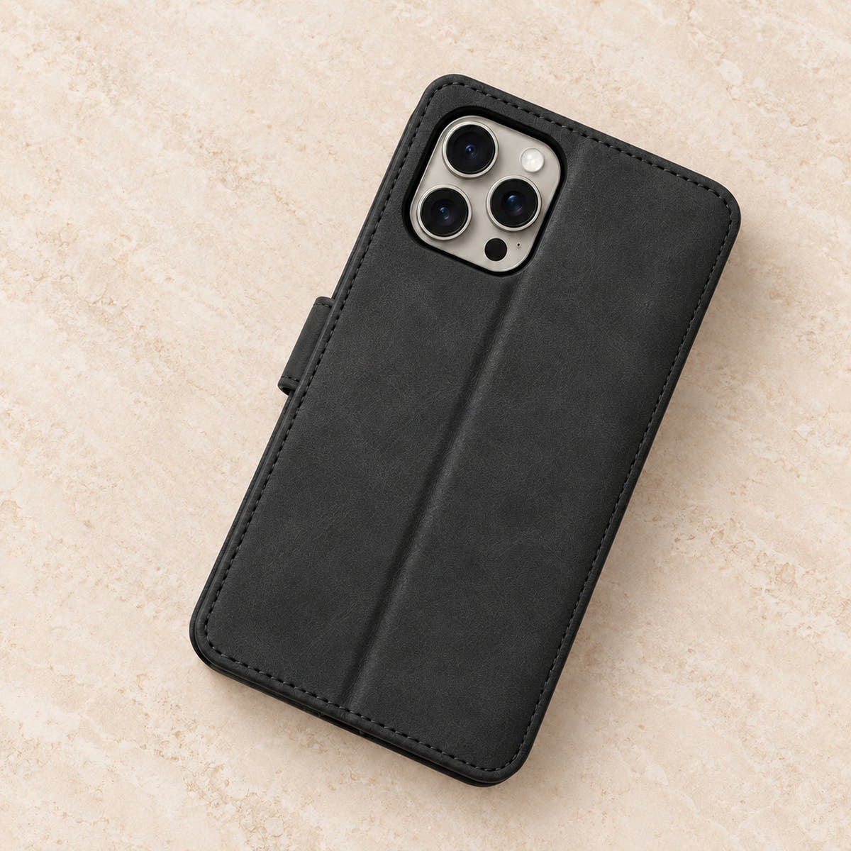Floral embossed iPhone flip wallet case in Black — plain rear panel and three-lens camera opening