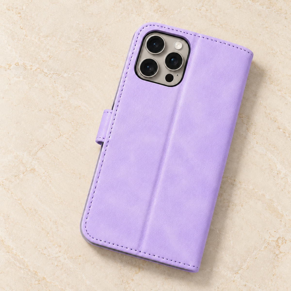 Floral embossed iPhone flip wallet case in Lavender — plain rear panel and three-lens camera opening