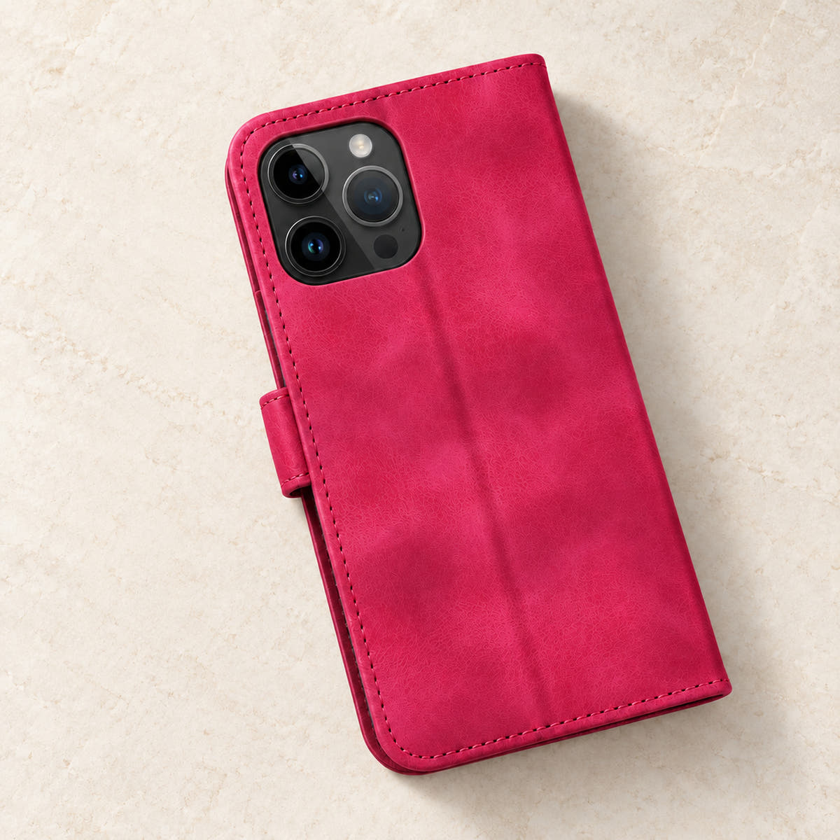Floral embossed iPhone flip wallet case in Red — plain rear panel and three-lens camera opening