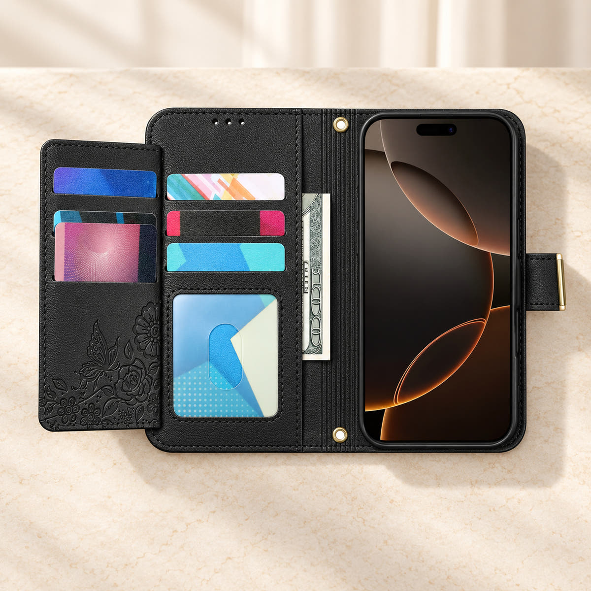 Black floral iPhone wallet case opened to show the fold-out card flap, inner card slots, ID window, note compartment and fitted phone holder