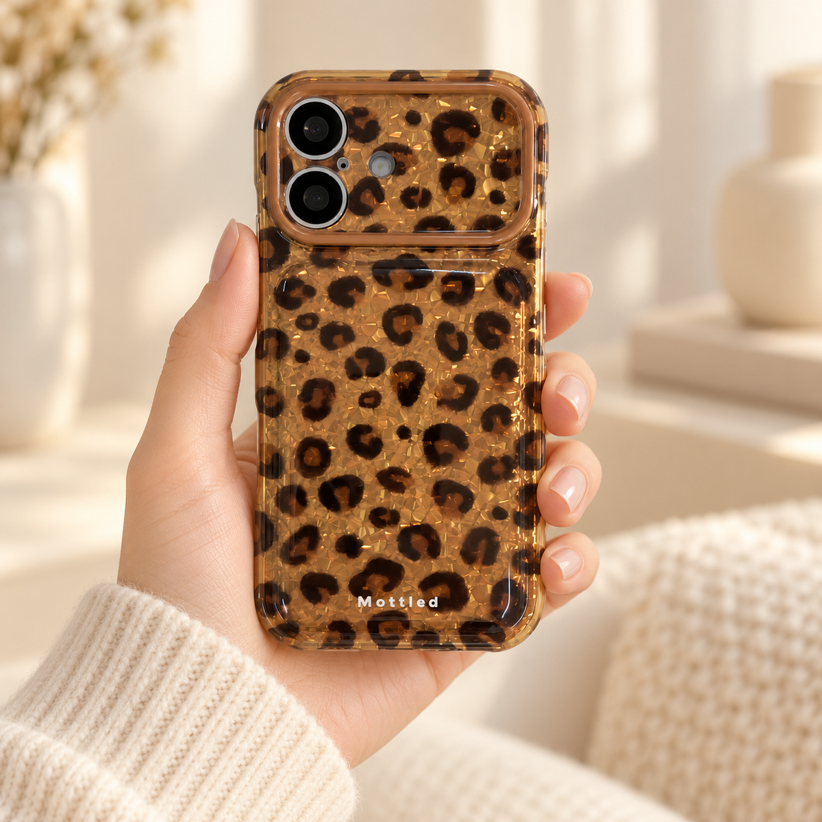 Glitter Leopard iPhone Case in Gold — handheld rear view