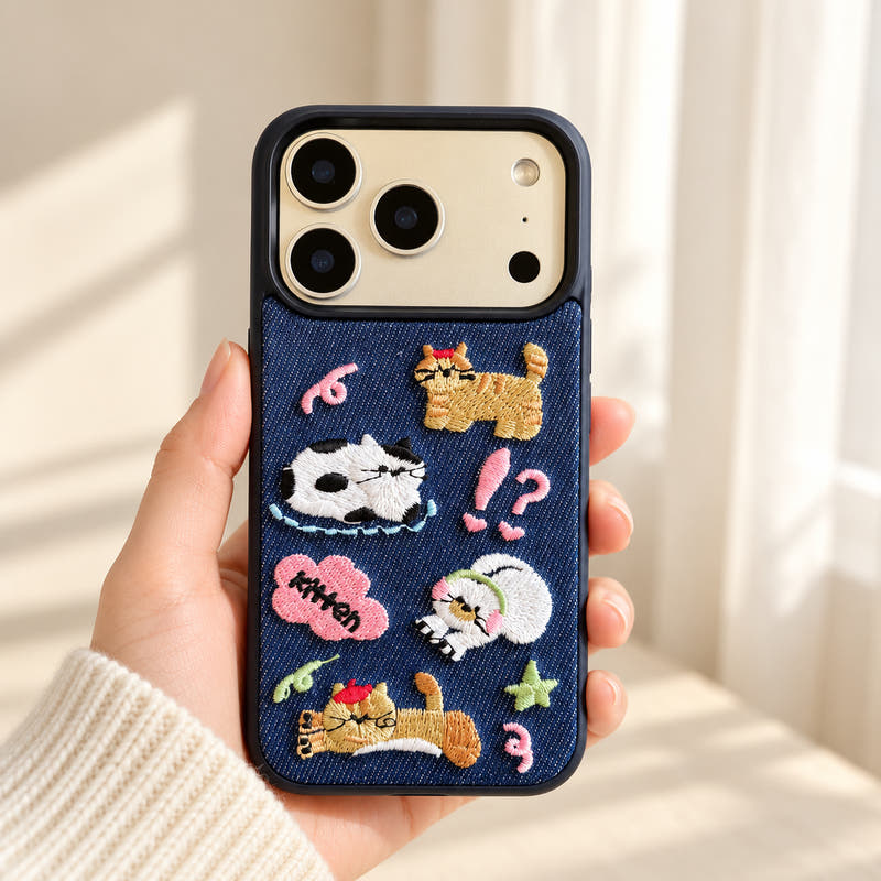 Kawaii Cat Embroidered Denim iPhone case held upright showing its full back design