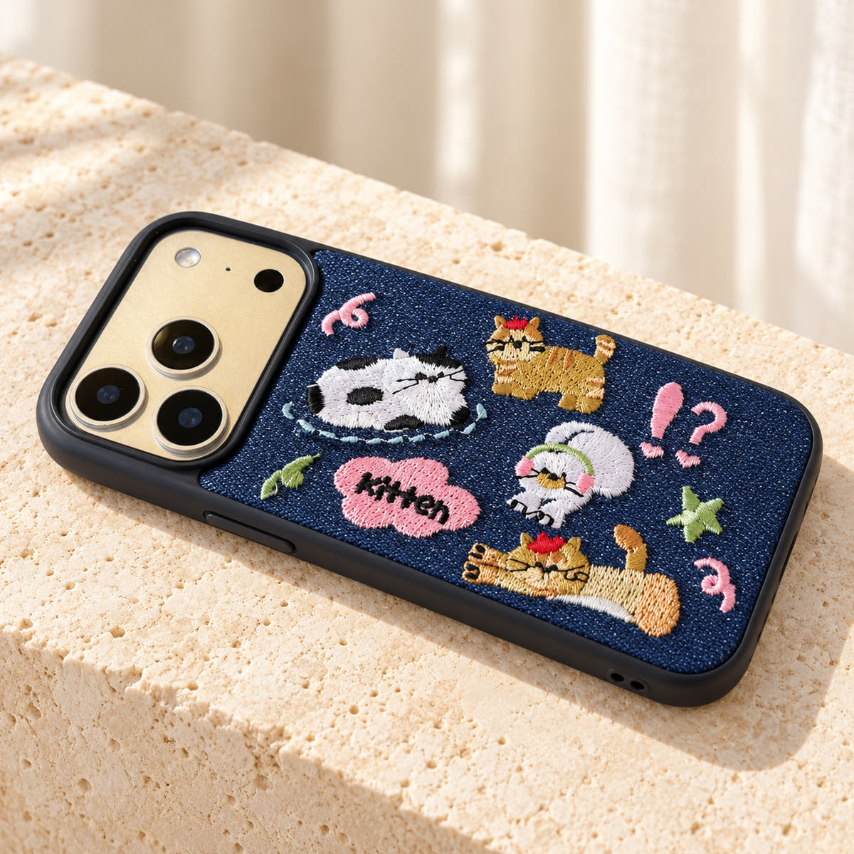 Kawaii Cat Embroidered Denim iPhone case — landscape tabletop view