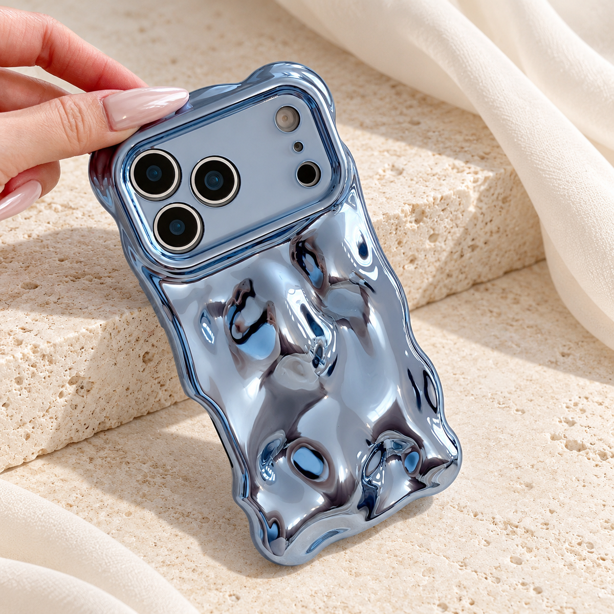 Liquid Chrome Wave iPhone case in Blue shown in a natural lifestyle view.