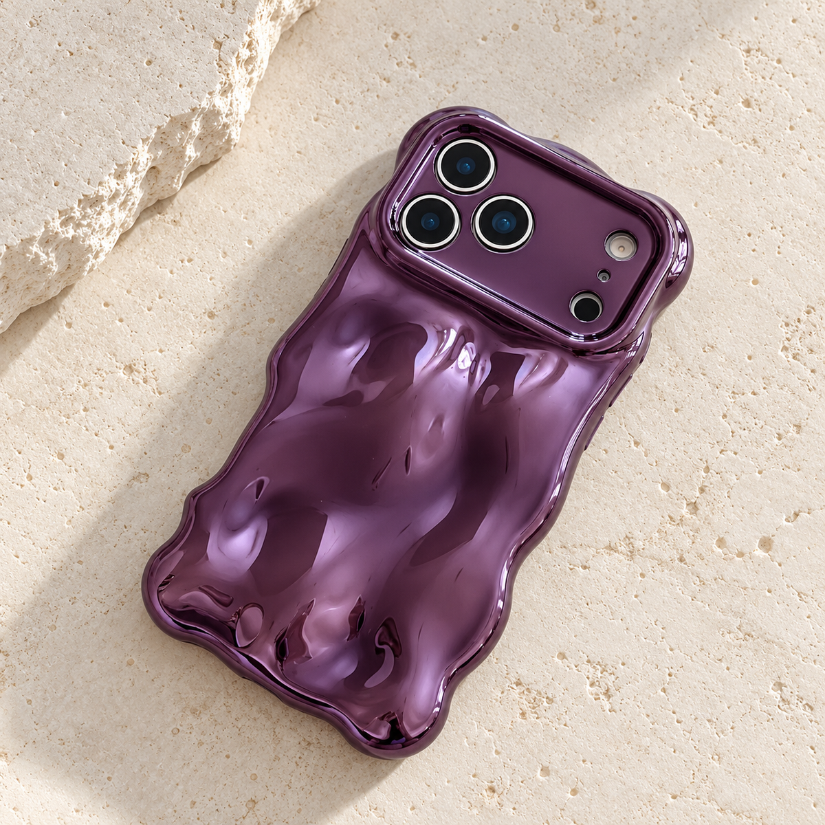 Diagonal flat-lay of the Purple Liquid Chrome Wave case showing its wavy outline.