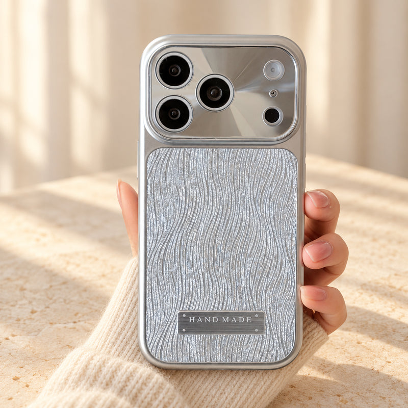 Luna Belle textured shimmer iPhone case in Silver, held upright.