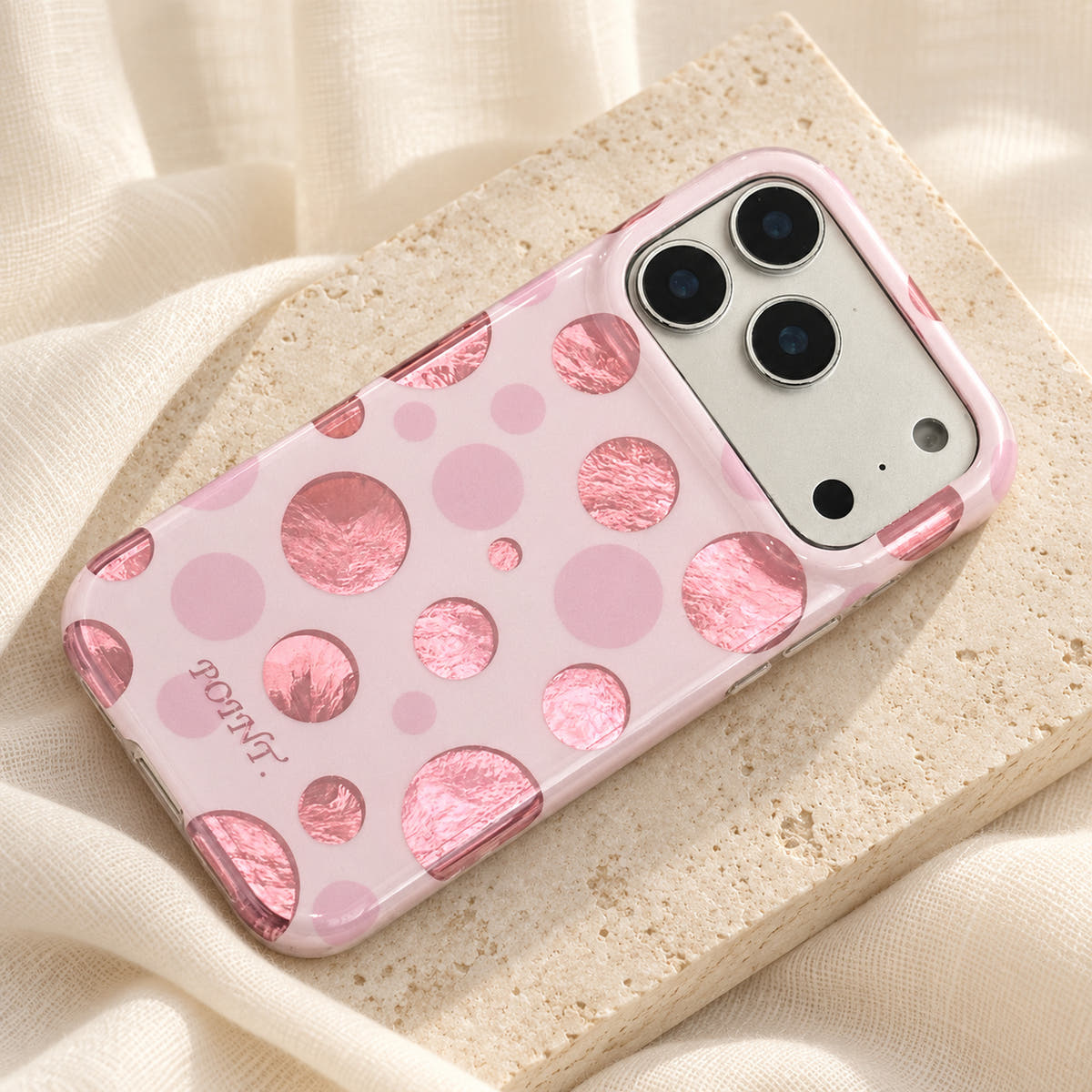 Metallic Dots & Stars iPhone case in Pink — linen flatlay view