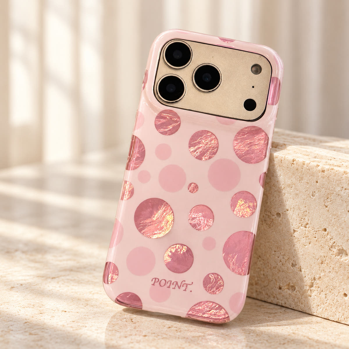 Metallic Dots & Stars iPhone case in Pink — tabletop view
