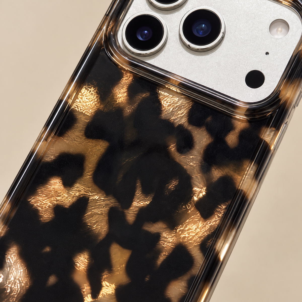 Dark Tortoiseshell iPhone case with black and warm brown mottled pattern — tortoiseshell pattern macro.