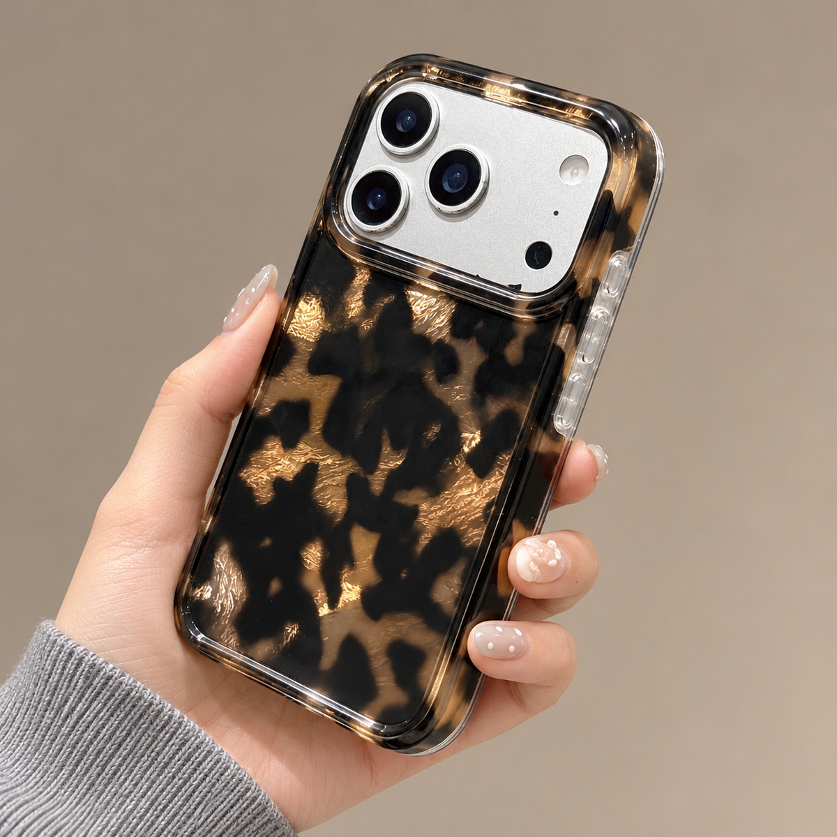 Dark Tortoiseshell iPhone case with black and warm brown mottled pattern — full angled rear and side.