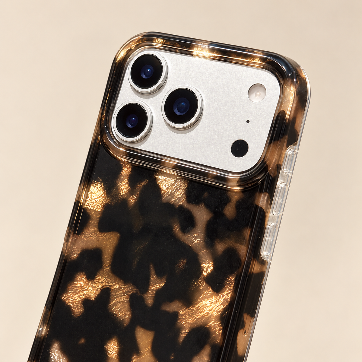Dark Tortoiseshell iPhone case with black and warm brown mottled pattern — top edge and rear close view.