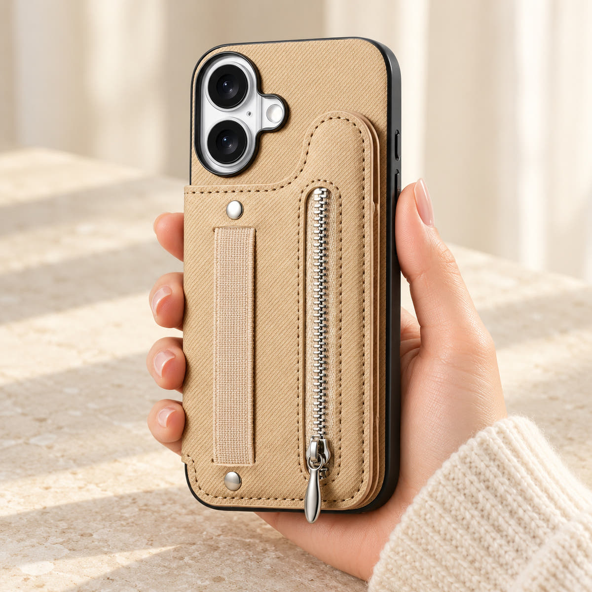 Multi-Pocket iPhone wallet case in Beige held upright, showing the rear wallet, fabric hand strap and silver zip