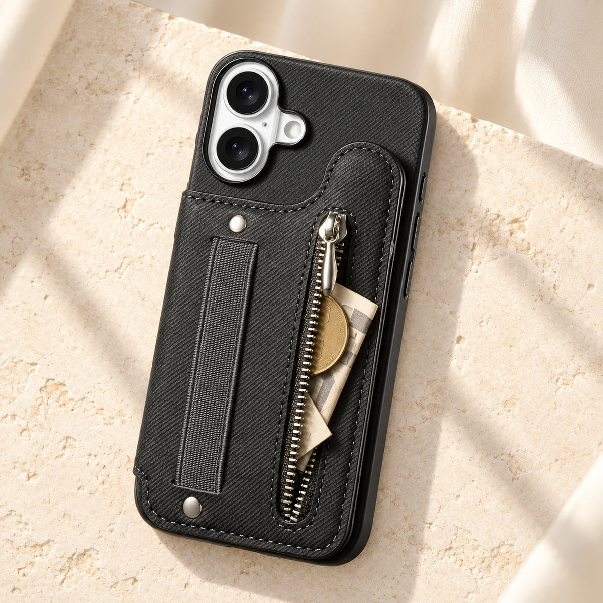 Multi-Pocket iPhone wallet case in Black on cream limestone with its rear zip pocket open