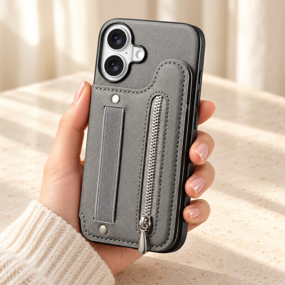 Multi-Pocket iPhone wallet case in Gray held upright, showing the rear wallet, fabric hand strap and silver zip