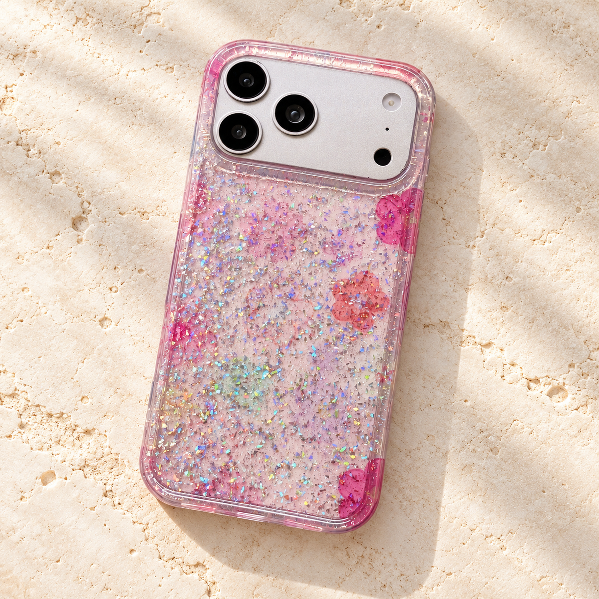 Floral Pink case resting rear-up on an ivory stone tabletop.