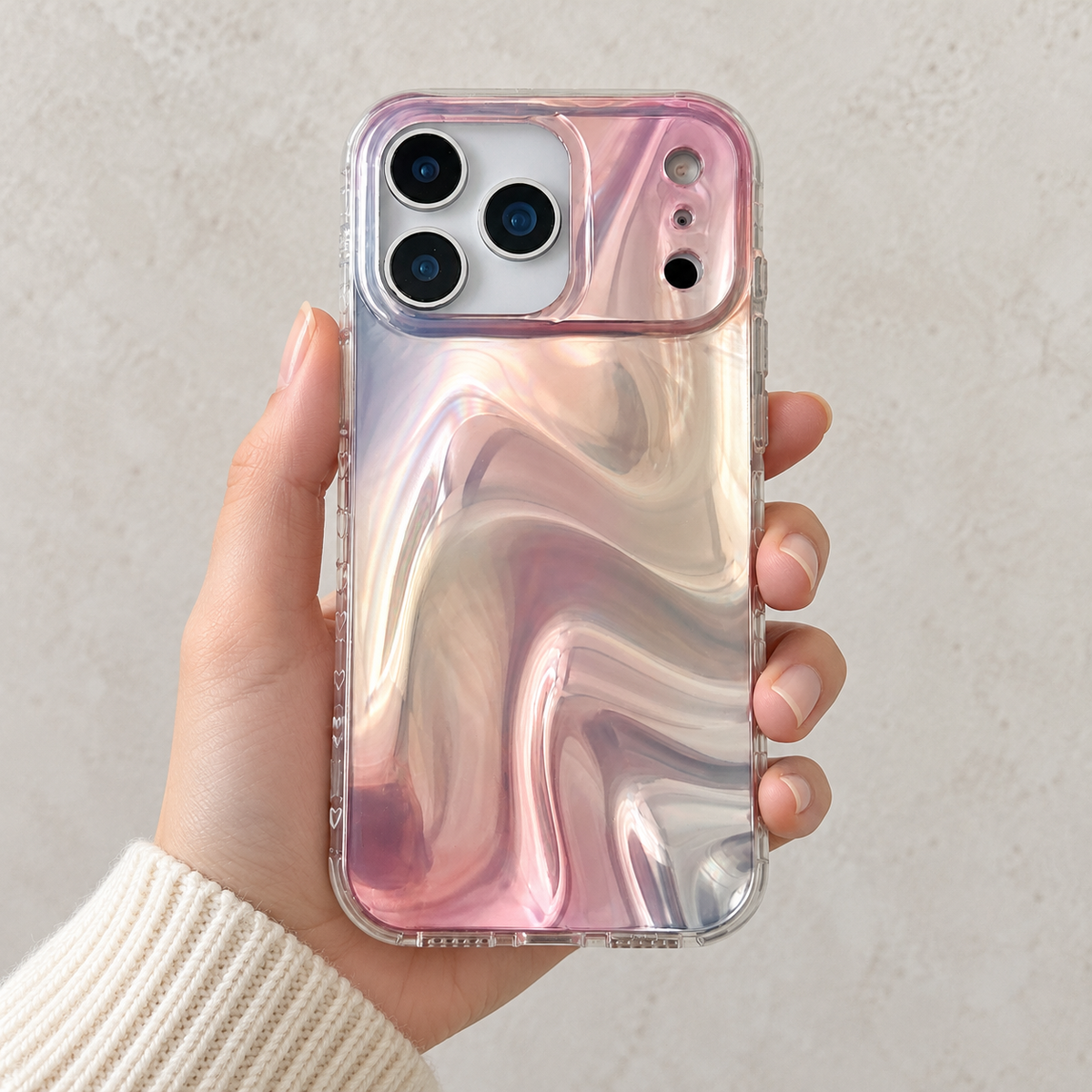 Iridescent Rose case held upright in one hand with an ivory knit sleeve.