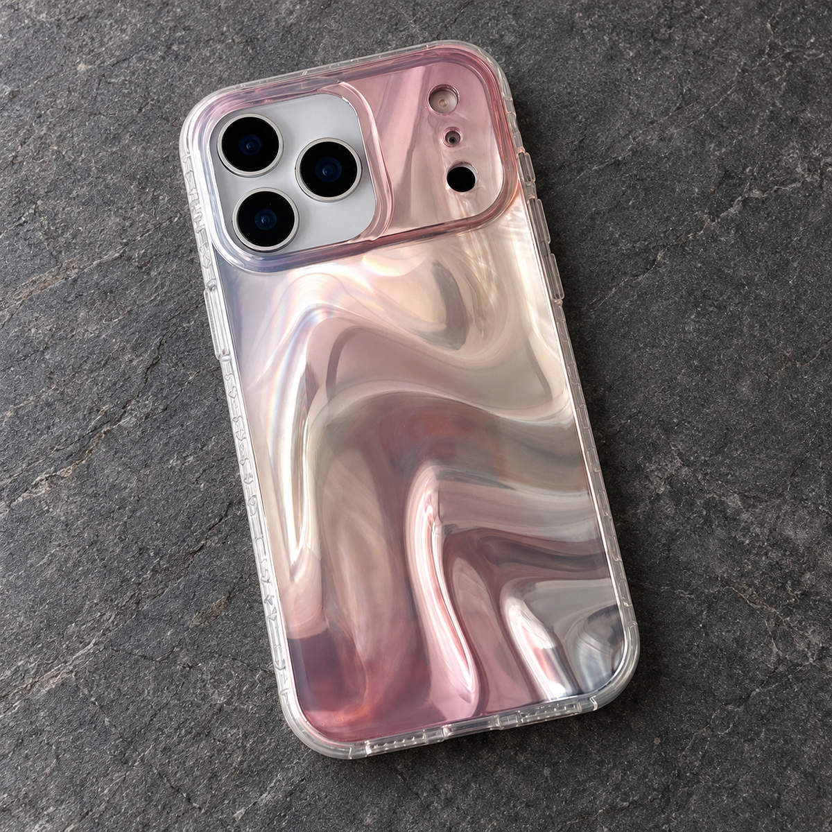 Iridescent Rose case photographed from above on a charcoal-grey stone surface.