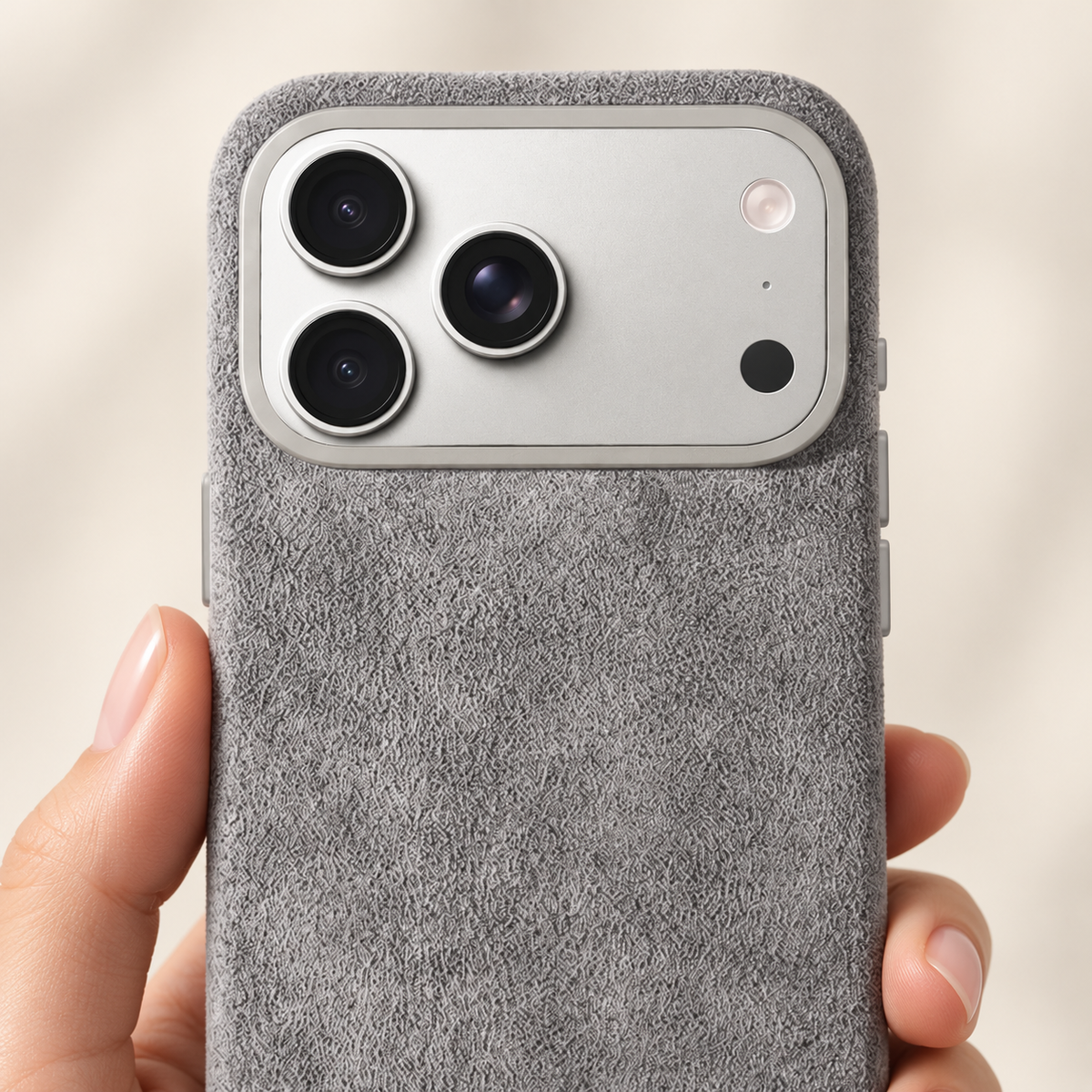 Light Grey suede-look textured iPhone case in a close view of its native camera surround and rear finish.