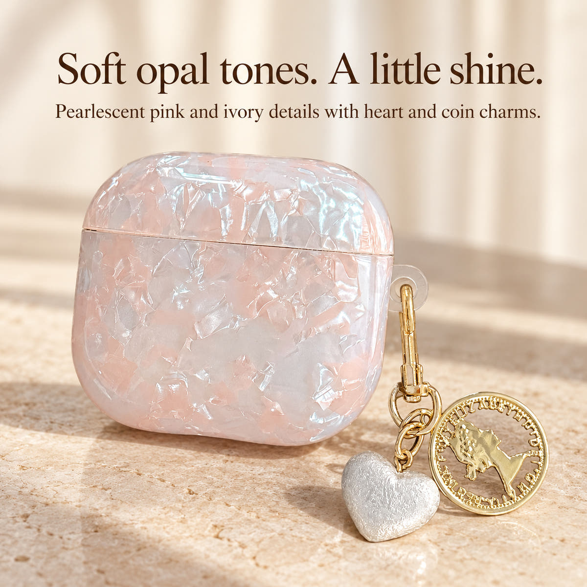 Opal Marble AirPods Case: Pearlescent pink and ivory details with heart and coin charms.