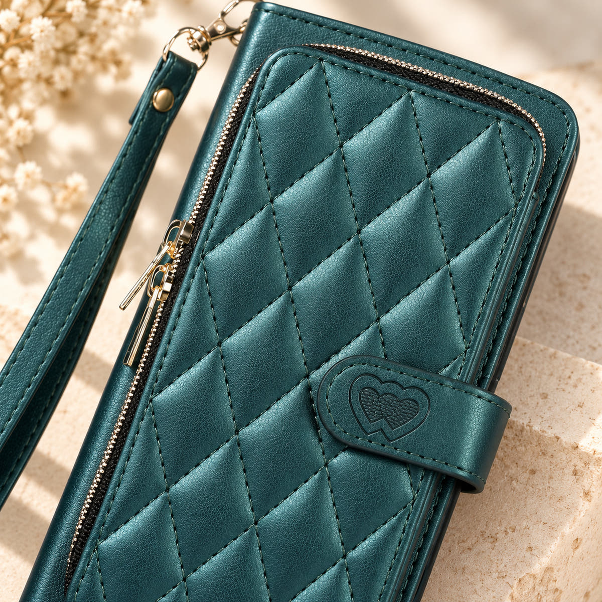 Forest Green padded zip wallet close-up of quilting zipper and embossed heart closure