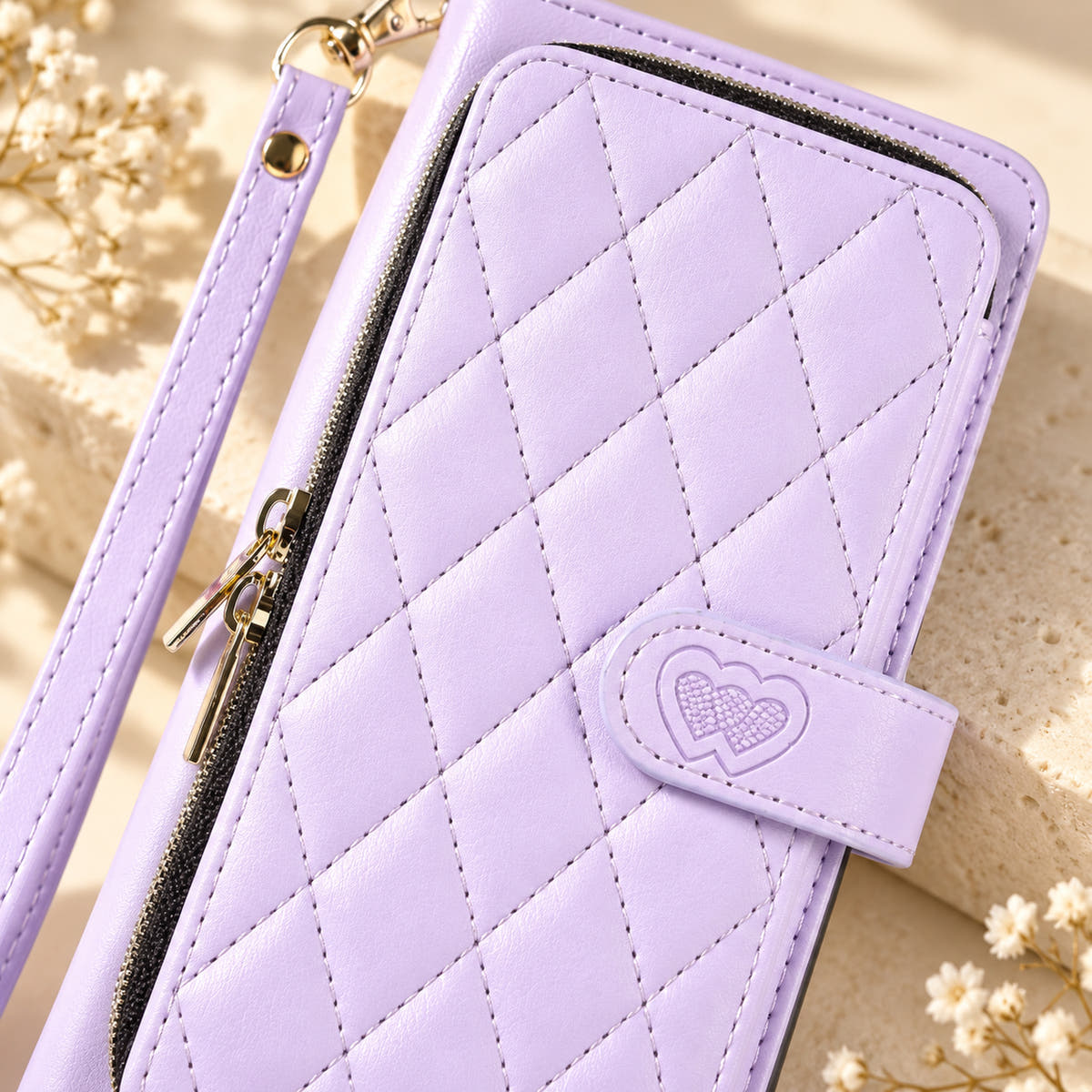 Lavender padded zip wallet close-up of quilting zipper and embossed heart closure