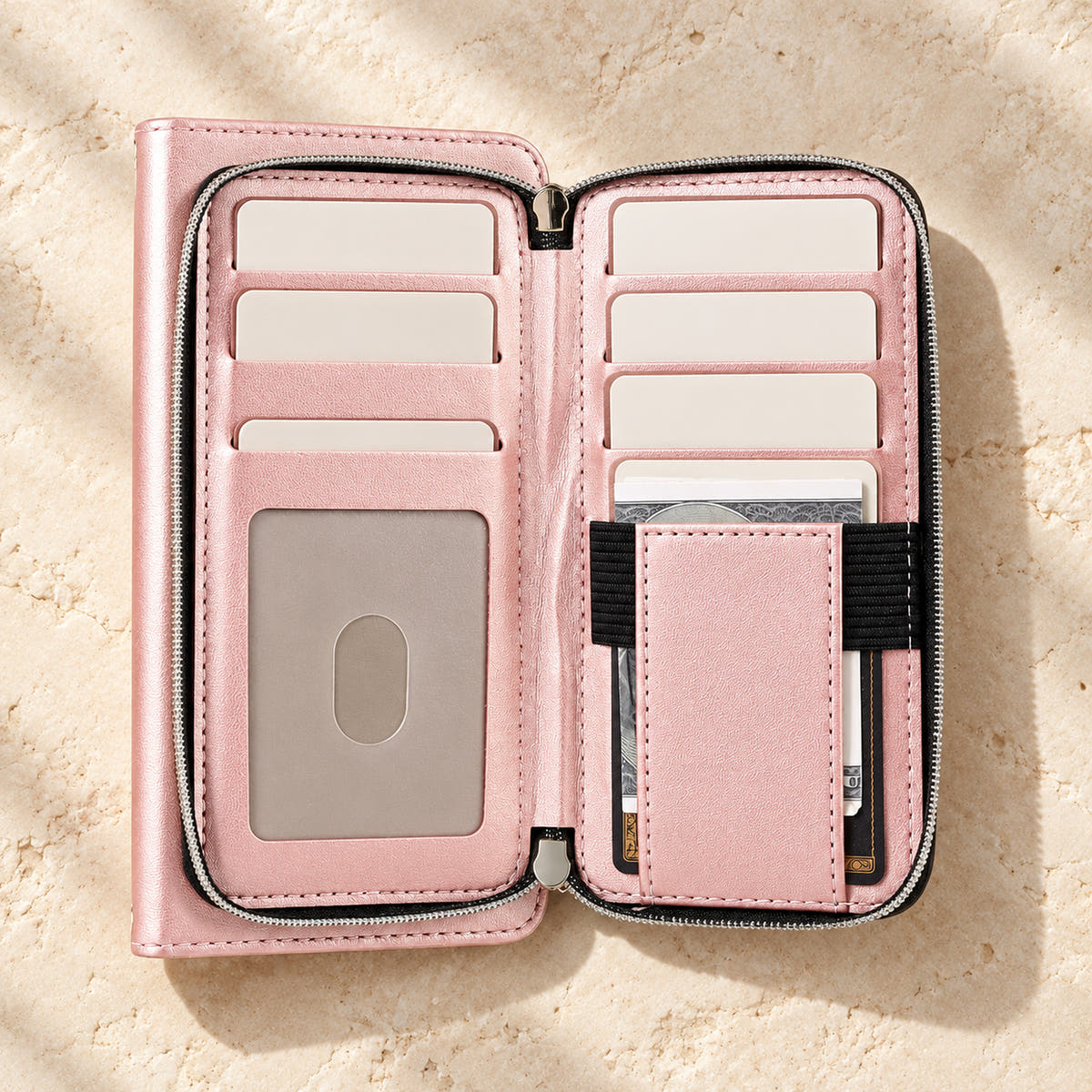Pink padded wallet with zip compartment open showing card and ID storage