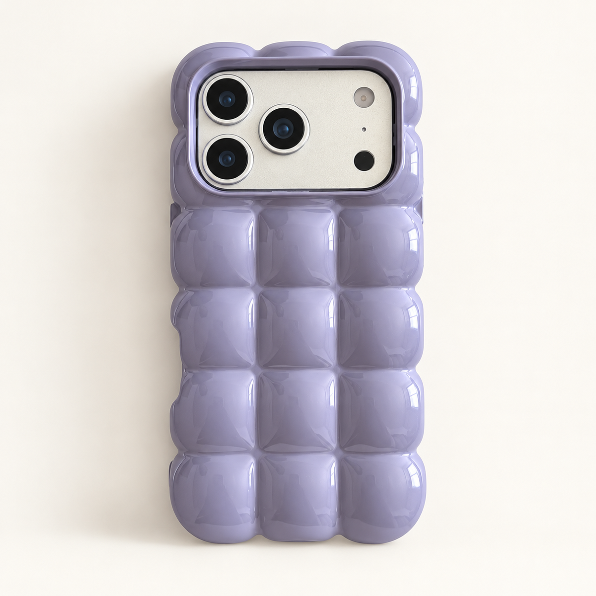 Lavender puffy grid iPhone case with rounded-square back and scalloped edges — full rear studio view.