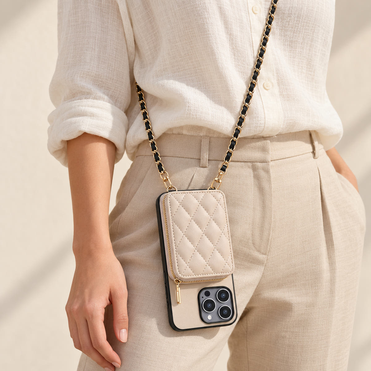 Beige quilted iPhone wallet case — crossbody carry with chain attached to the bottom loops
