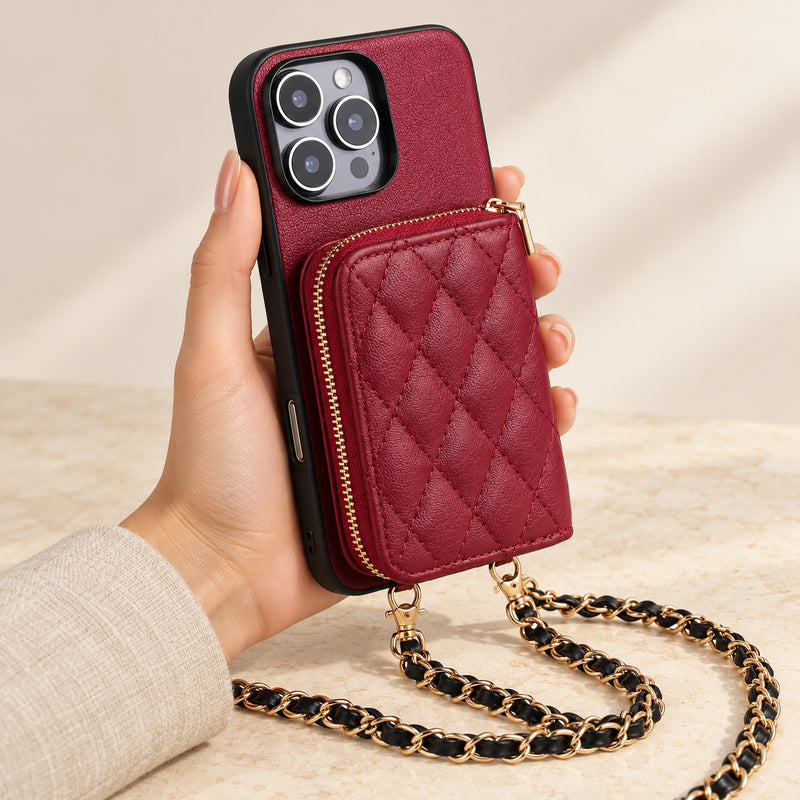 Red quilted iPhone wallet case — handheld view with zip wallet and chain