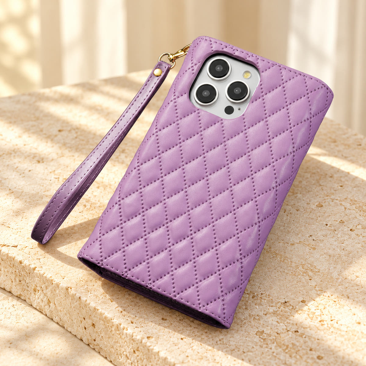 Rear view of the Lavender Quilted Zip Wallet iPhone case, showing the diamond-quilted back, camera opening and detachable wrist loop.