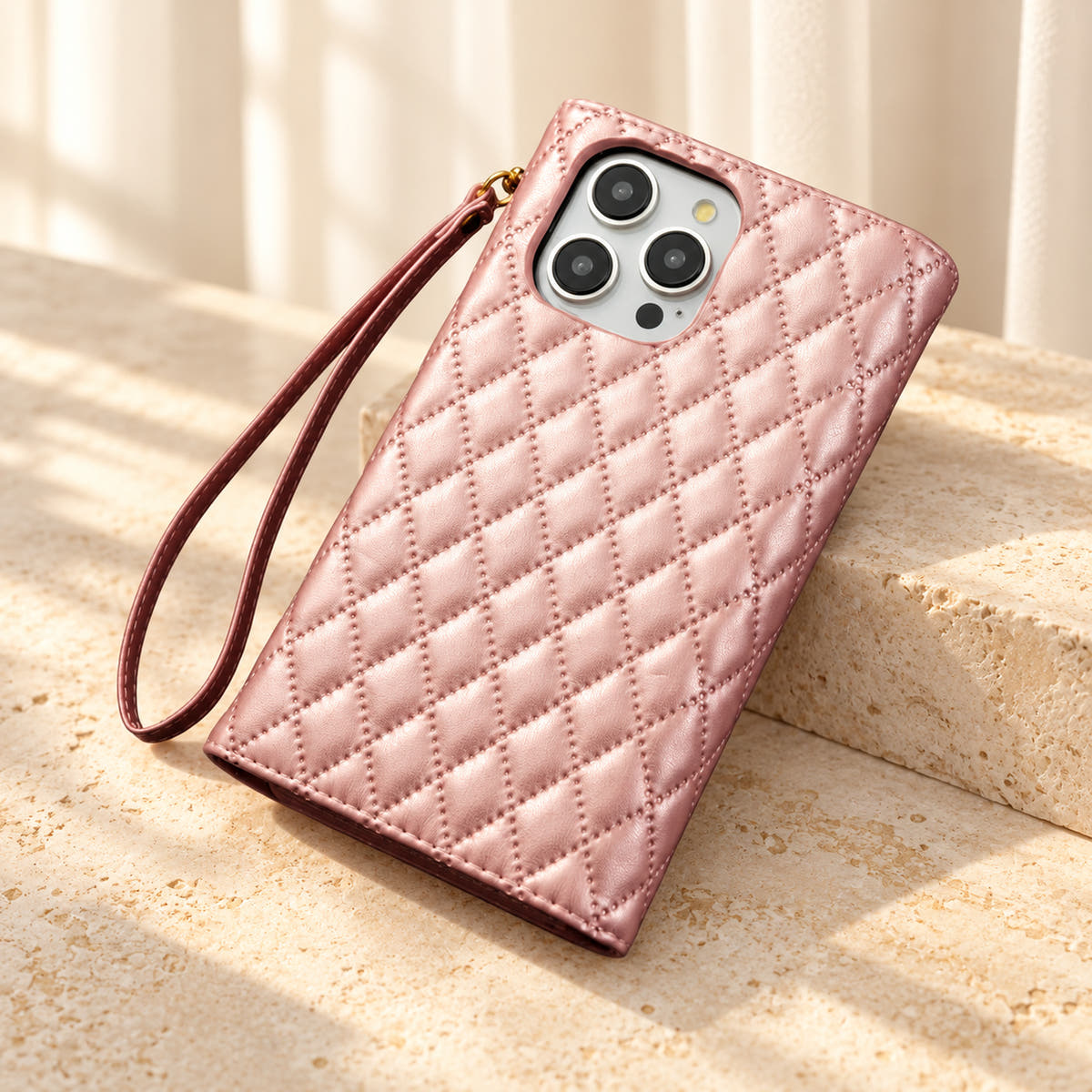 Rear view of the Pink Quilted Zip Wallet iPhone case, showing the diamond-quilted back, camera opening and detachable wrist loop.