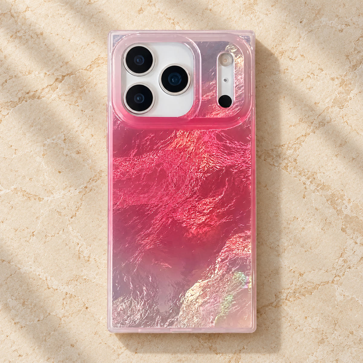 Overhead rear view of the Radiant Wave pink and silver iridescent iPhone case