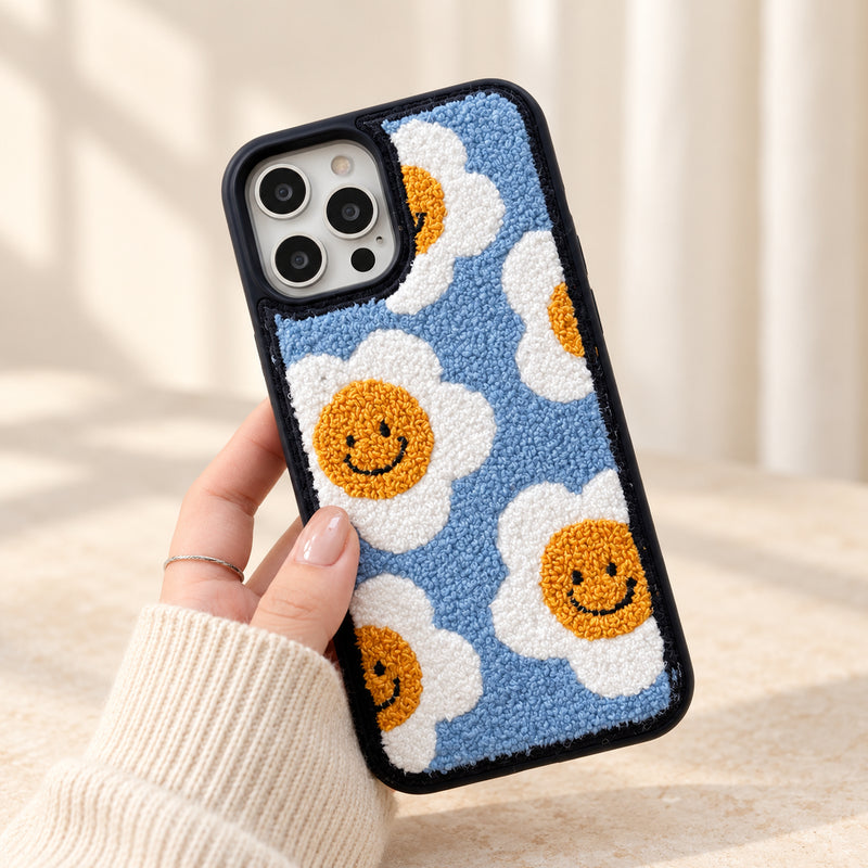 Smiley Daisy Tufted Fabric iPhone case held upright showing its full back design