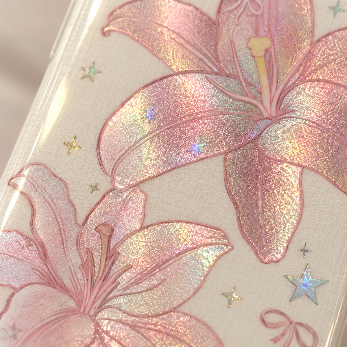 Small reflective star details beside the blush floral artwork.